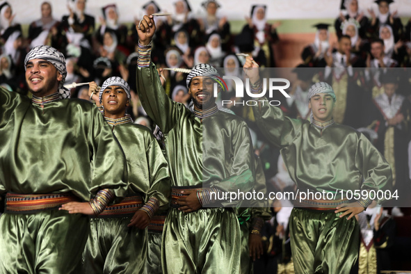 Students from the University of Al-aqsa celebrate graduation during an annual ceremony, in Khan Yunis in the southern Gaza Strip, on October...