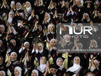 Students from the University of Al-aqsa celebrate graduation during an annual ceremony, in Khan Yunis in the southern Gaza Strip, on October...