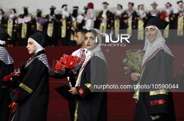 Students from the University of Al-aqsa celebrate graduation during an annual ceremony, in Khan Yunis in the southern Gaza Strip, on October...