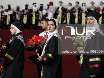 Students from the University of Al-aqsa celebrate graduation during an annual ceremony, in Khan Yunis in the southern Gaza Strip, on October...