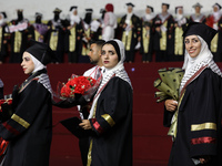 Students from the University of Al-aqsa celebrate graduation during an annual ceremony, in Khan Yunis in the southern Gaza Strip, on October...