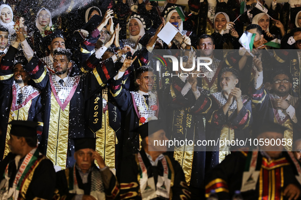 Students from the University of Al-aqsa celebrate graduation during an annual ceremony, in Khan Yunis in the southern Gaza Strip, on October...