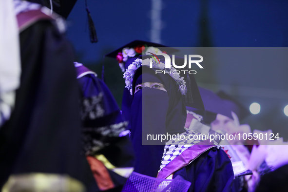 Students from the University of Al-aqsa celebrate graduation during an annual ceremony, in Khan Yunis in the southern Gaza Strip, on October...