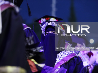 Students from the University of Al-aqsa celebrate graduation during an annual ceremony, in Khan Yunis in the southern Gaza Strip, on October...