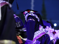 Students from the University of Al-aqsa celebrate graduation during an annual ceremony, in Khan Yunis in the southern Gaza Strip, on October...