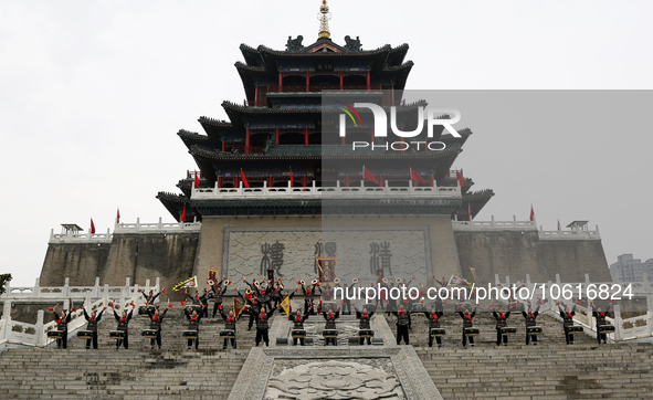 Students practice the ''Battle drum of the Qin and Han Dynasties'' below the Wei River in Xianyang City, Shaanxi Province, China, Oct 8, 202...