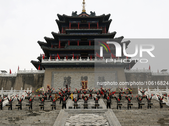 Students practice the ''Battle drum of the Qin and Han Dynasties'' below the Wei River in Xianyang City, Shaanxi Province, China, Oct 8, 202...