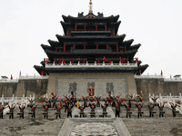 Students practice the ''Battle drum of the Qin and Han Dynasties'' below the Wei River in Xianyang City, Shaanxi Province, China, Oct 8, 202...