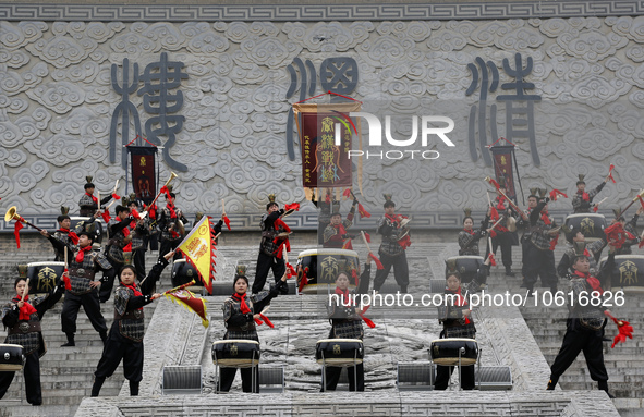 Students practice the ''Battle drum of the Qin and Han Dynasties'' below the Wei River in Xianyang City, Shaanxi Province, China, Oct 8, 202...