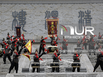 Students practice the ''Battle drum of the Qin and Han Dynasties'' below the Wei River in Xianyang City, Shaanxi Province, China, Oct 8, 202...