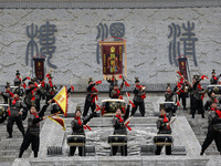 Students practice the ''Battle drum of the Qin and Han Dynasties'' below the Wei River in Xianyang City, Shaanxi Province, China, Oct 8, 202...