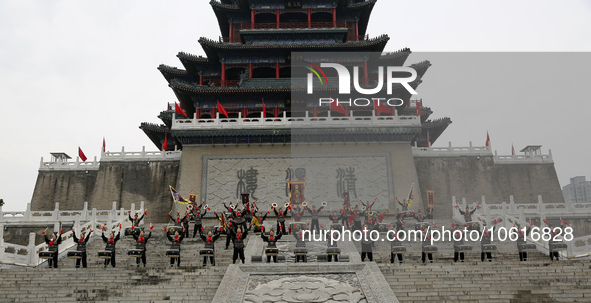 Students practice the ''Battle drum of the Qin and Han Dynasties'' below the Wei River in Xianyang City, Shaanxi Province, China, Oct 8, 202...