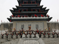 Students practice the ''Battle drum of the Qin and Han Dynasties'' below the Wei River in Xianyang City, Shaanxi Province, China, Oct 8, 202...