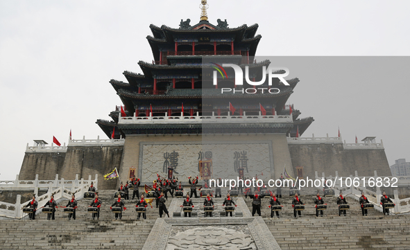 Students practice the ''Battle drum of the Qin and Han Dynasties'' below the Wei River in Xianyang City, Shaanxi Province, China, Oct 8, 202...