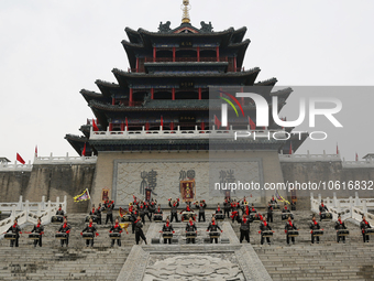 Students practice the ''Battle drum of the Qin and Han Dynasties'' below the Wei River in Xianyang City, Shaanxi Province, China, Oct 8, 202...