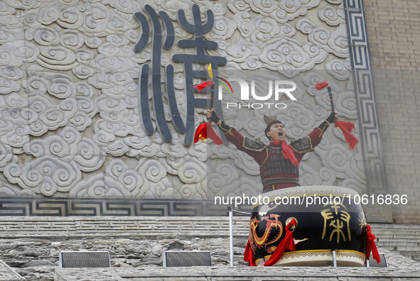 Students practice the ''Battle drum of the Qin and Han Dynasties'' below the Wei River in Xianyang City, Shaanxi Province, China, Oct 8, 202...