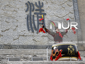 Students practice the ''Battle drum of the Qin and Han Dynasties'' below the Wei River in Xianyang City, Shaanxi Province, China, Oct 8, 202...