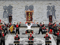 Huang Jianmin, an inheritor of the Qin and Han Dynasty battle drum, practices the ''Qin and Han Dynasty battle drum'' with students at the d...