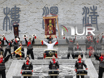 Huang Jianmin, an inheritor of the Qin and Han Dynasty battle drum, practices the ''Qin and Han Dynasty battle drum'' with students at the d...