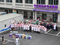 Doctors, nurses and volunteers hold a ceremony at Shaoxing Central Hospital to celebrate the completion of the task of providing medical car...