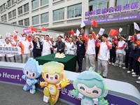 Doctors, nurses and volunteers hold a ceremony at Shaoxing Central Hospital to celebrate the completion of the task of providing medical car...