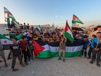Syrians and Palestinians are participating in a solidarity rally with the Palestinian people in Deir Ballout camp in the countryside of Alep...