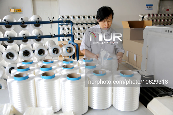 LIANYUNGANG, CHINA - OCTOBER 12, 2023 - A worker works at a workshop of a new materials company in Lianyungang, East China's Jiangsu Provinc...