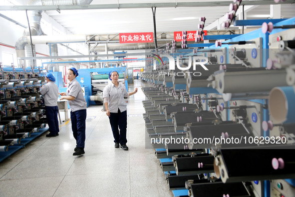 LIANYUNGANG, CHINA - OCTOBER 12, 2023 - A worker works at a workshop of a new materials company in Lianyungang, East China's Jiangsu Provinc...