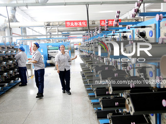 LIANYUNGANG, CHINA - OCTOBER 12, 2023 - A worker works at a workshop of a new materials company in Lianyungang, East China's Jiangsu Provinc...