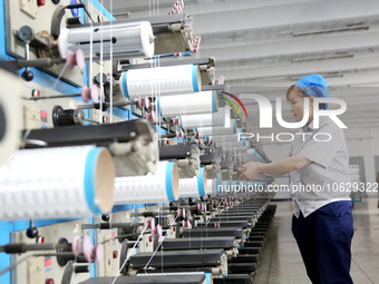 LIANYUNGANG, CHINA - OCTOBER 12, 2023 - A worker works at a workshop of a new materials company in Lianyungang, East China's Jiangsu Provinc...