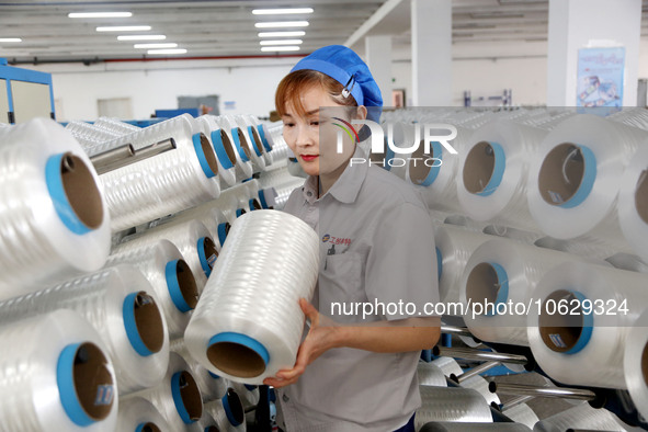 LIANYUNGANG, CHINA - OCTOBER 12, 2023 - A worker works at a workshop of a new materials company in Lianyungang, East China's Jiangsu Provinc...