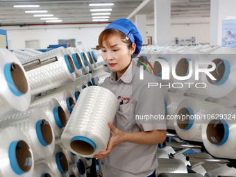 LIANYUNGANG, CHINA - OCTOBER 12, 2023 - A worker works at a workshop of a new materials company in Lianyungang, East China's Jiangsu Provinc...