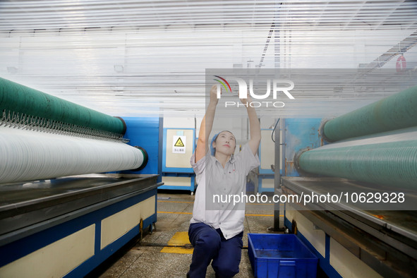 LIANYUNGANG, CHINA - OCTOBER 12, 2023 - A worker works at a workshop of a new materials company in Lianyungang, East China's Jiangsu Provinc...