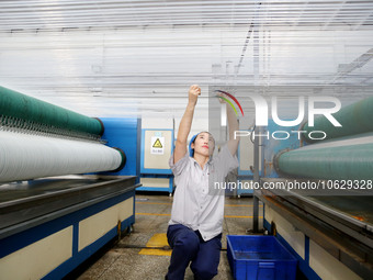 LIANYUNGANG, CHINA - OCTOBER 12, 2023 - A worker works at a workshop of a new materials company in Lianyungang, East China's Jiangsu Provinc...