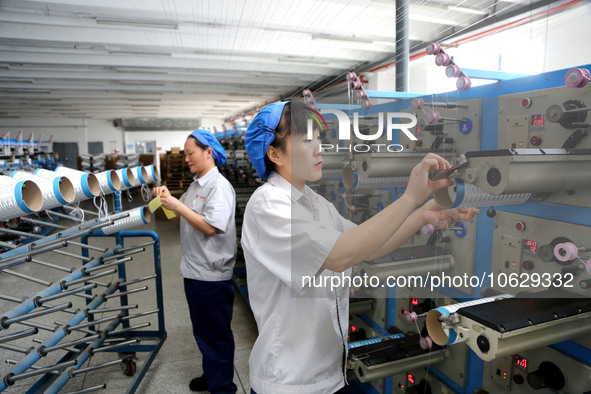 LIANYUNGANG, CHINA - OCTOBER 12, 2023 - A worker works at a workshop of a new materials company in Lianyungang, East China's Jiangsu Provinc...