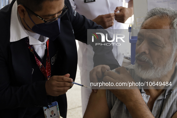 October 16, 2023, Mexico City, Mexico: Citizens are vaccinated at the start of the national vaccination campaign against influenza and Covid...