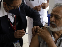 October 16, 2023, Mexico City, Mexico: Citizens are vaccinated at the start of the national vaccination campaign against influenza and Covid...