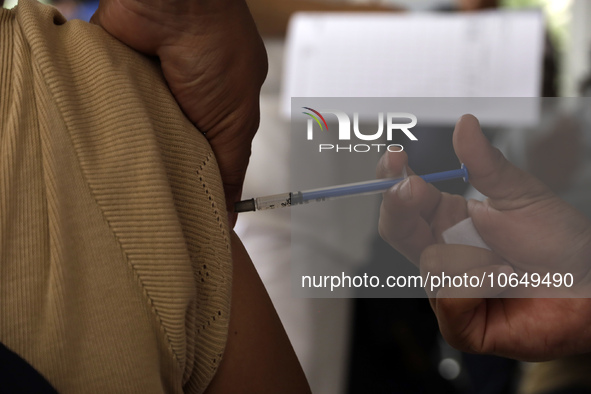 October 16, 2023, Mexico City, Mexico: Citizens are vaccinated at the start of the national vaccination campaign against influenza and Covid...