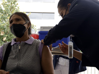 October 16, 2023, Mexico City, Mexico: Citizens are vaccinated at the start of the national vaccination campaign against influenza and Covid...