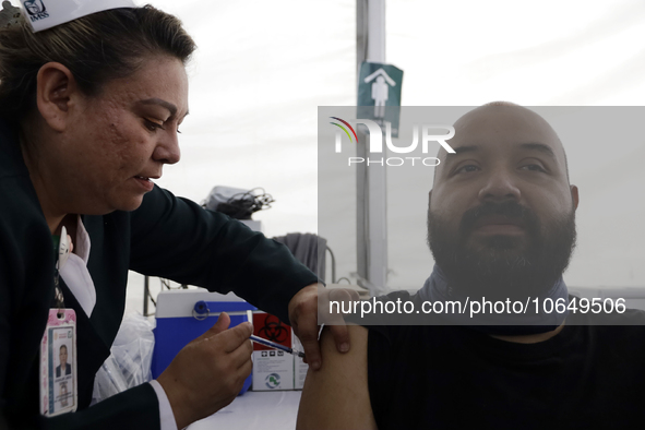 October 16, 2023, Mexico City, Mexico: Citizens are vaccinated at the start of the national vaccination campaign against influenza and Covid...