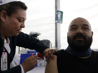 October 16, 2023, Mexico City, Mexico: Citizens are vaccinated at the start of the national vaccination campaign against influenza and Covid...