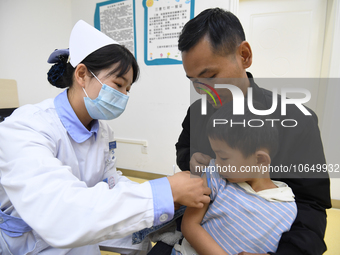 GUIYANG, CHINA - OCTOBER 17, 2023 - A medical worker inoculates children with China's first quadrivalent subunit influenza vaccine at a comm...