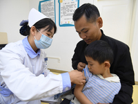 GUIYANG, CHINA - OCTOBER 17, 2023 - A medical worker inoculates children with China's first quadrivalent subunit influenza vaccine at a comm...