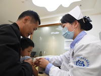 GUIYANG, CHINA - OCTOBER 17, 2023 - A medical worker inoculates children with China's first quadrivalent subunit influenza vaccine at a comm...