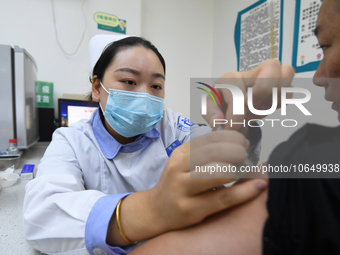 GUIYANG, CHINA - OCTOBER 17, 2023 - A medical worker inoculates people with China's first quadrivalent subunit influenza vaccine at a commun...