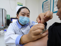 GUIYANG, CHINA - OCTOBER 17, 2023 - A medical worker inoculates people with China's first quadrivalent subunit influenza vaccine at a commun...