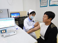 GUIYANG, CHINA - OCTOBER 17, 2023 - A medical worker inoculates people with China's first quadrivalent subunit influenza vaccine at a commun...