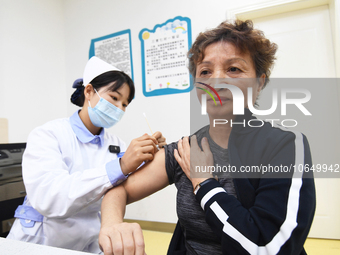 GUIYANG, CHINA - OCTOBER 17, 2023 - A medical worker inoculates people with China's first quadrivalent subunit influenza vaccine at a commun...