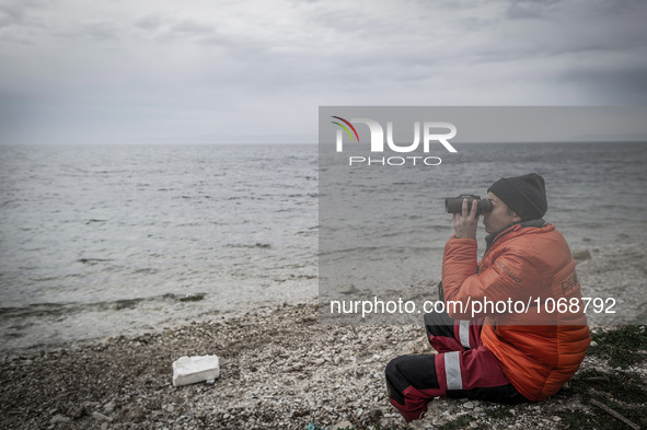 A volunteer looking for incoming boats with Migrants in Mytilene, island of Lesbos, Greece, on February 24, 2016. More than 110,000 migrants...