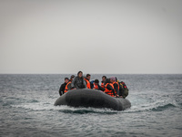 Refugees and migrants on a rubber boat arrive in Mytilene, island of Lesbos, Greece, on February 24, 2016. More than 110,000 migrants and re...